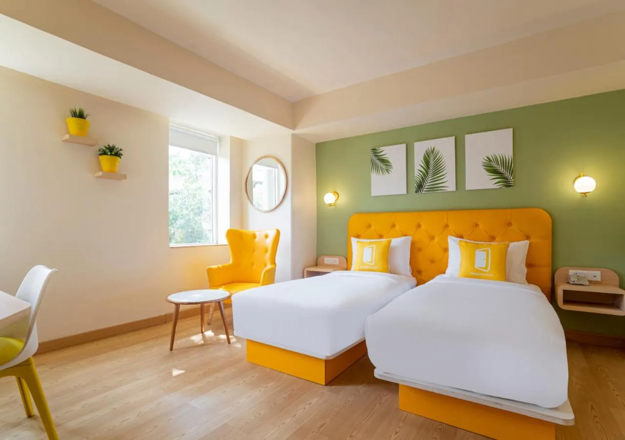 Photo of the whole room, Bed in Bloom Hotel - Sector 19