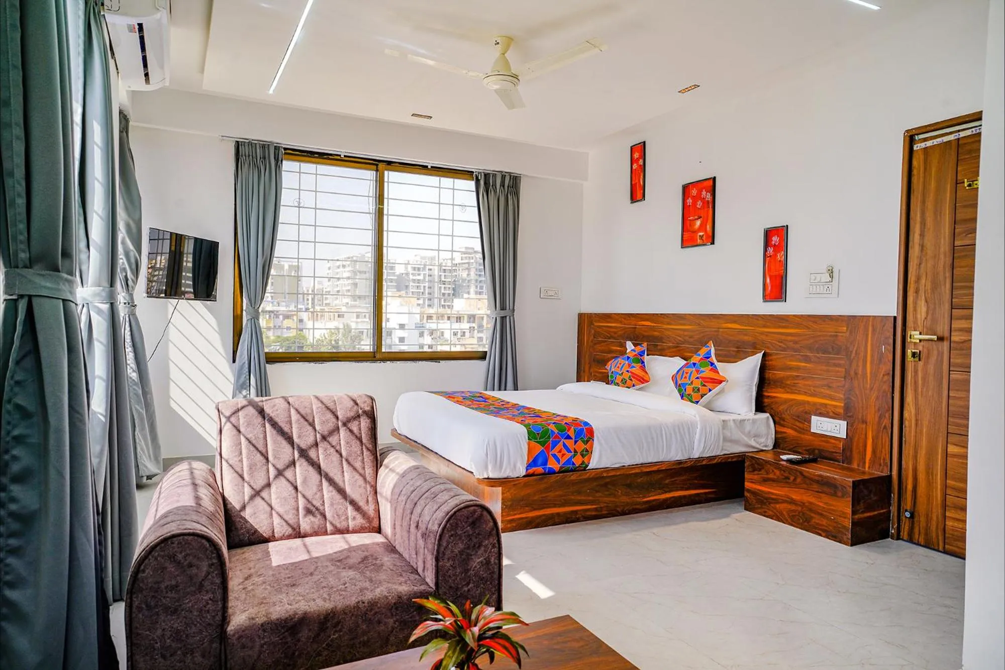 Communal lounge/ TV room, Bed in FabHotel Crystal Inn - Nr Suvarndeep Chowk