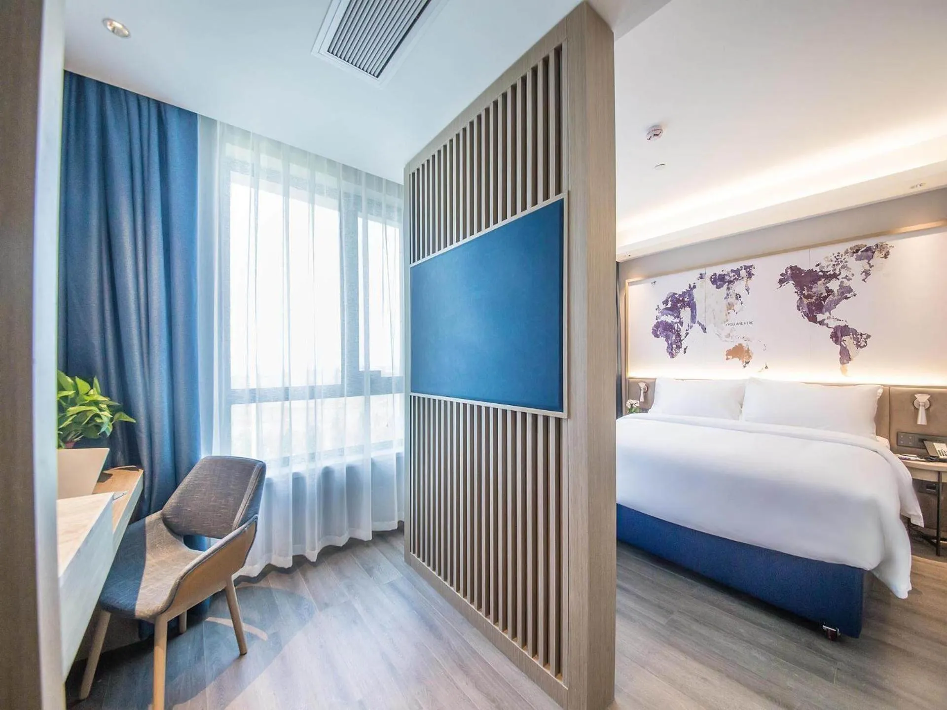 Bed in Kyriad Marvelous Hotel Qinhuangdao Nandaihe