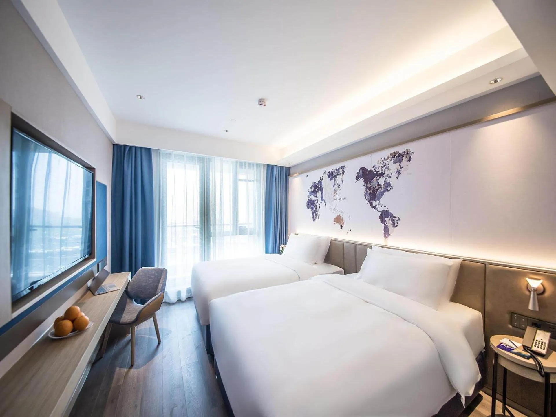 Bed in Kyriad Marvelous Hotel Qinhuangdao Nandaihe