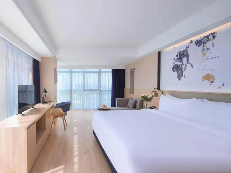 Bed in Kyriad Marvelous Hotel Suzhou Wujiang People Square
