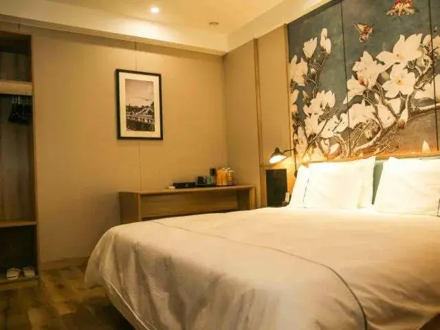 Bed in Magnolia Business Hotel Yangzhou Wanda Plaza Shunda Road Bed in Magnolia Business Hotel Yangzhou Wanda Plaza Shunda Road