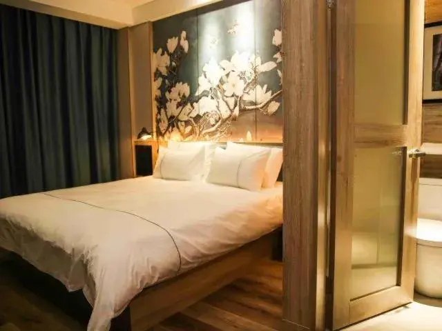 Bed in Magnolia Business Hotel Yangzhou Wanda Plaza Shunda Road Bed in Magnolia Business Hotel Yangzhou Wanda Plaza Shunda Road