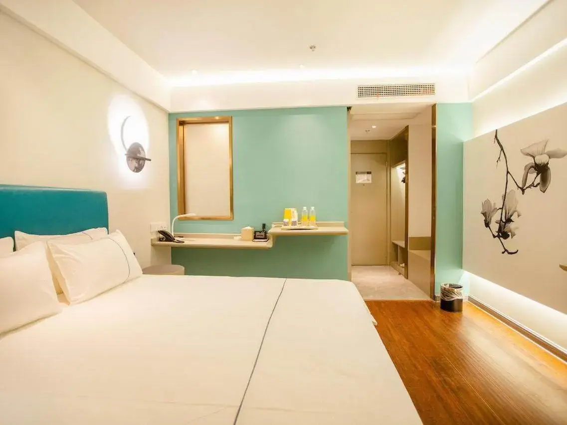 Bed in Magnotel Hotel Yangzhou Jinghua Wangyue Road Bed in Magnotel Hotel Yangzhou Jinghua Wangyue Road