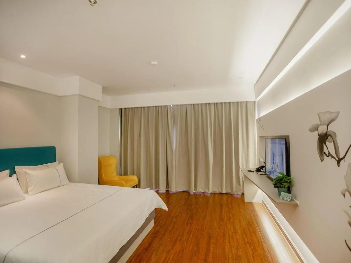 Bed in Magnotel Hotel Yangzhou Jinghua Wangyue Road