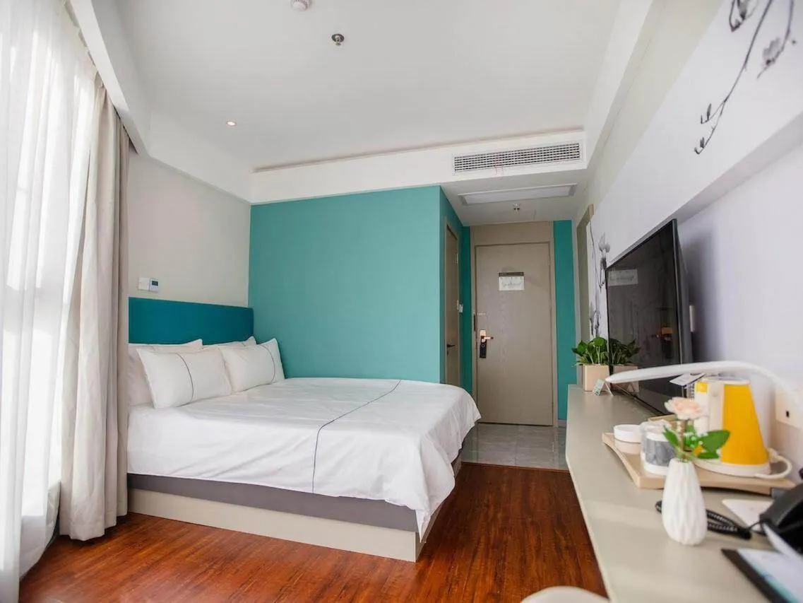 Bed in Magnotel Hotel Yangzhou Jinghua Wangyue Road