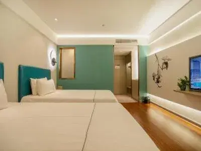 Bed in Magnotel Hotel Yangzhou Jinghua Wangyue Road Bed in Magnotel Hotel Yangzhou Jinghua Wangyue Road