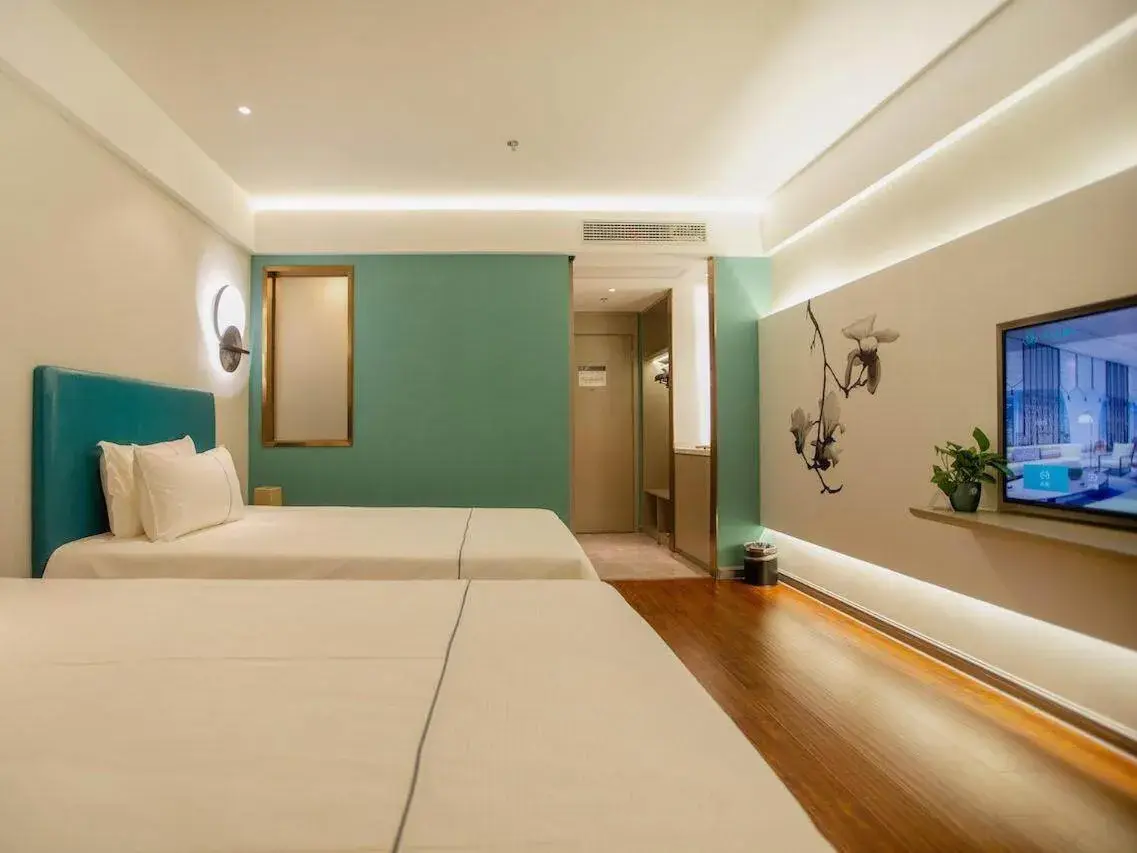 Bed in Magnotel Hotel Yangzhou Jinghua Wangyue Road Bed in Magnotel Hotel Yangzhou Jinghua Wangyue Road