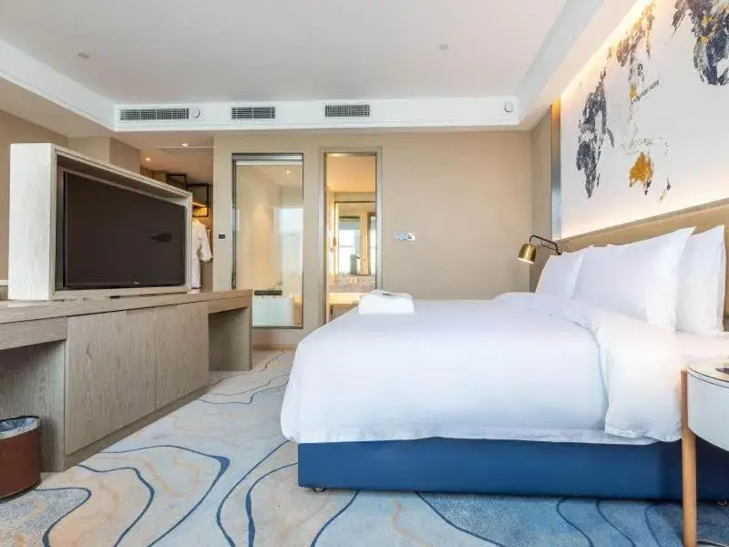 Bed in Kyriad Marvelous Hotel Shouguang Municipal Government Bed in Kyriad Marvelous Hotel Shouguang Municipal Government