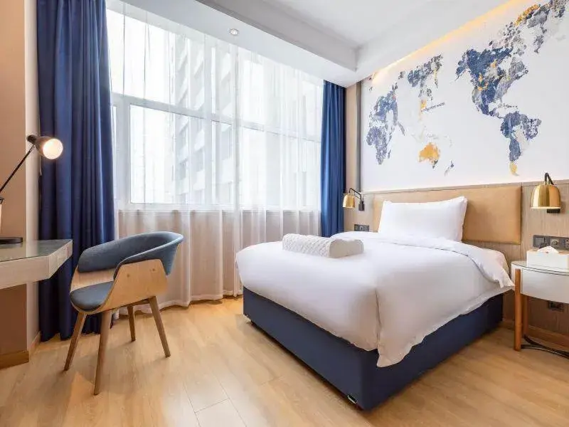 Bed in Kyriad Marvelous Hotel Shouguang Municipal Government Bed in Kyriad Marvelous Hotel Shouguang Municipal Government