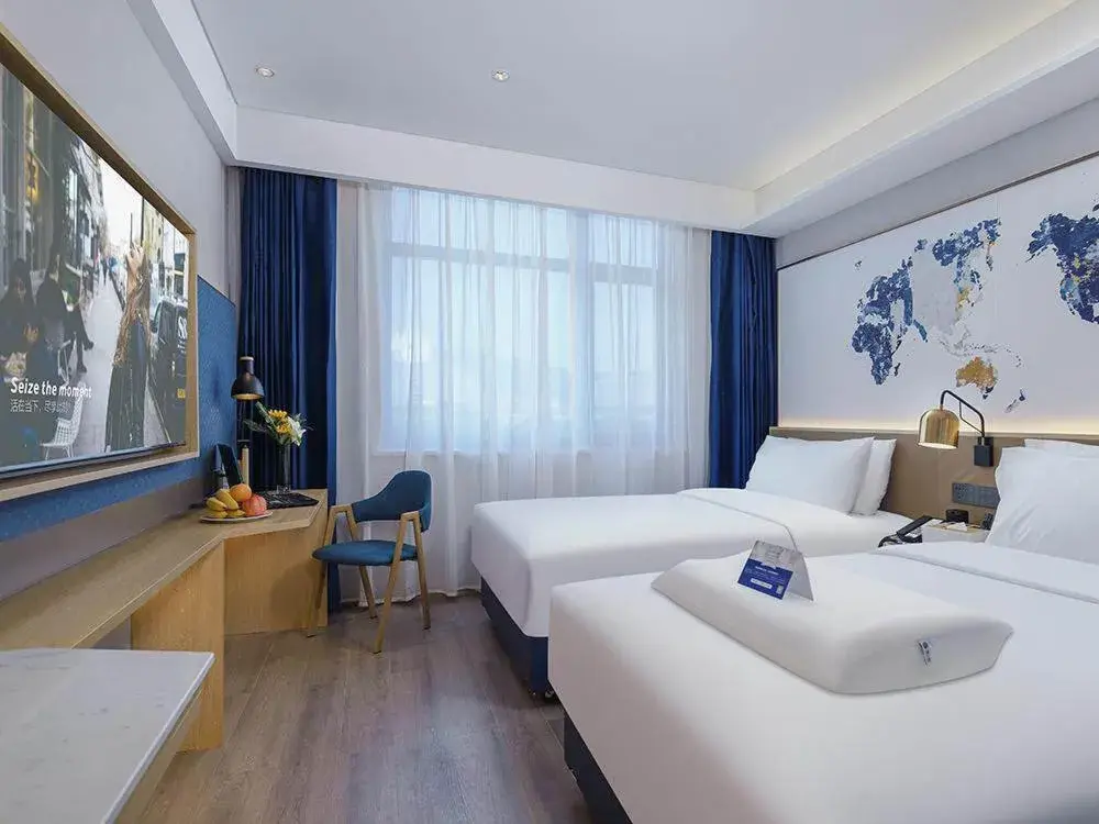 Bed in Kyriad Marvelous Hotel Weihai Happy Gate Weigao Plaza Bed in Kyriad Marvelous Hotel Weihai Happy Gate Weigao Plaza