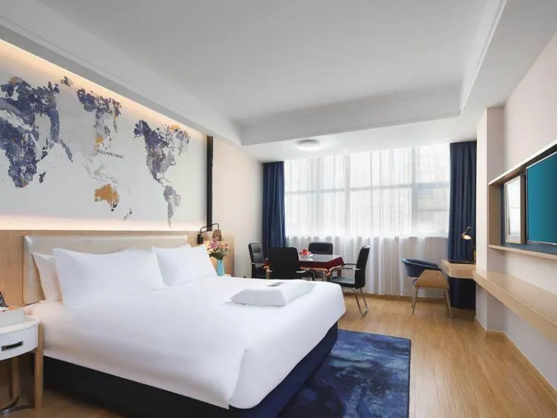 Bed in Kyriad Marvelous Hotel Yiyang Ziyang