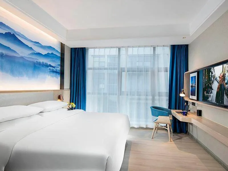 Bed in Kyriad Hotel Luoyang Longmen Railway Station