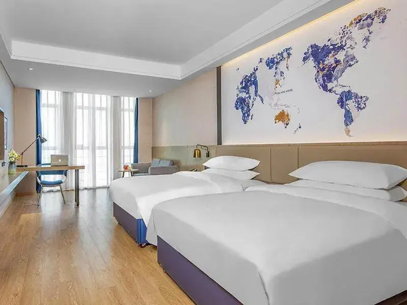 Bed in Kyriad Marvelous Hotel Huizhou Boluo Yuanzhou Bed in Kyriad Marvelous Hotel Huizhou Boluo Yuanzhou