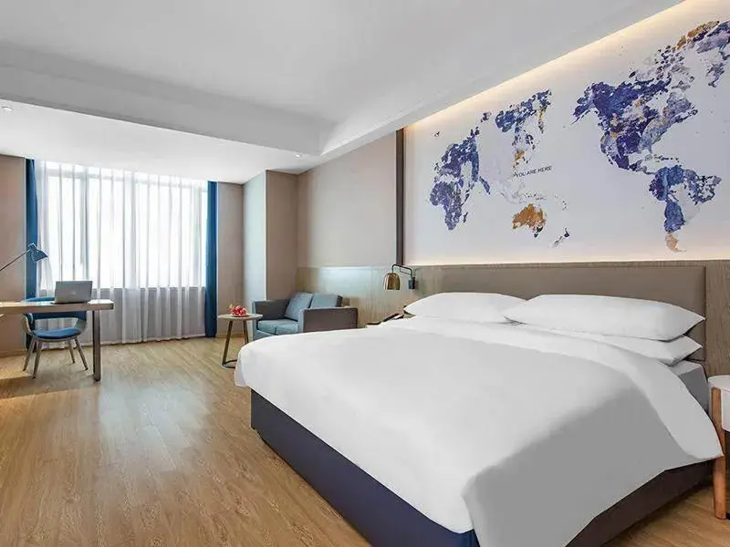 Bed in Kyriad Marvelous Hotel Huizhou Boluo Yuanzhou Bed in Kyriad Marvelous Hotel Huizhou Boluo Yuanzhou