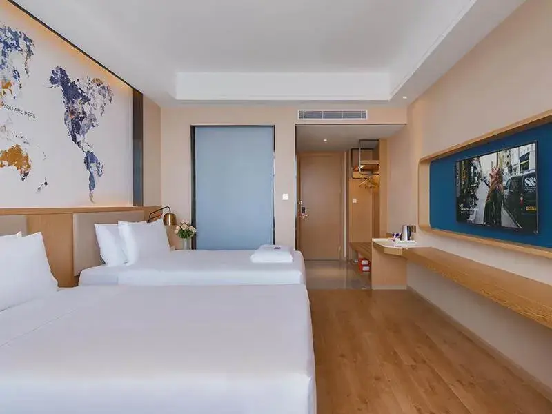Bed in Kyriad Marvelous Hotel Huizhou Boluo Longxi Bed in Kyriad Marvelous Hotel Huizhou Boluo Longxi