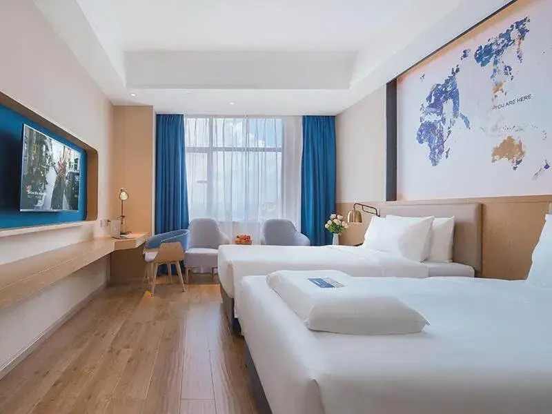 Bed in Kyriad Marvelous Hotel Huizhou Boluo Longxi Bed in Kyriad Marvelous Hotel Huizhou Boluo Longxi