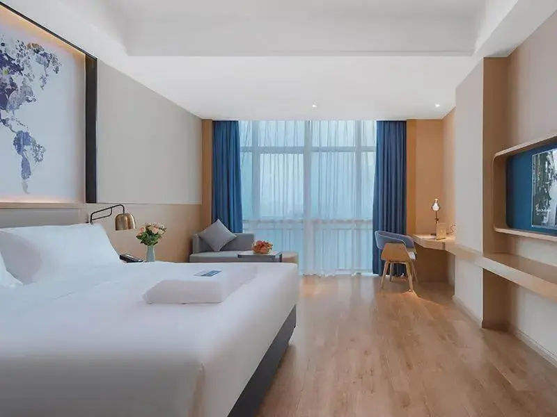 Bed in Kyriad Marvelous Hotel Huizhou Boluo Longxi Bed in Kyriad Marvelous Hotel Huizhou Boluo Longxi