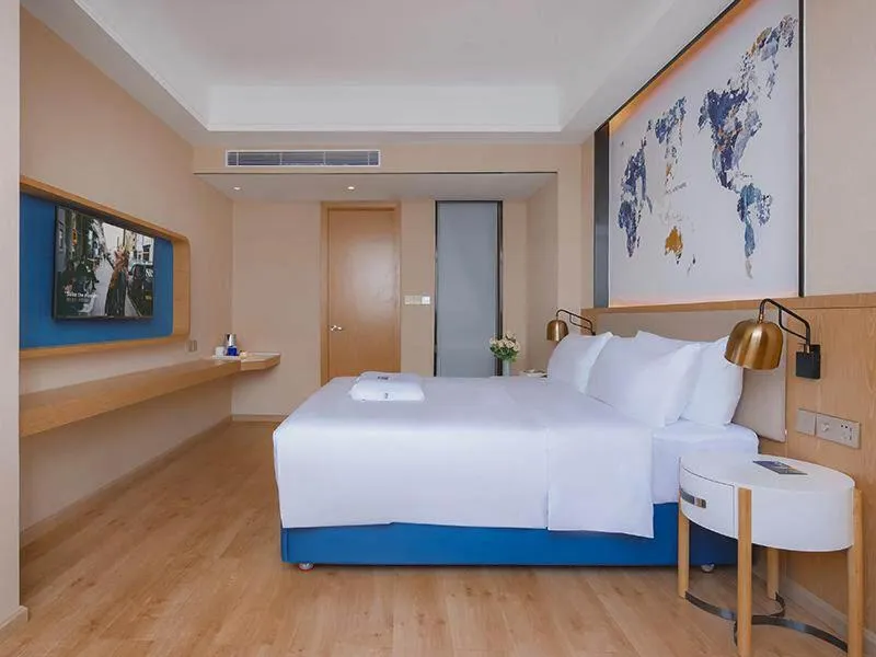 Bed in Kyriad Marvelous Hotel Huizhou Boluo Longxi