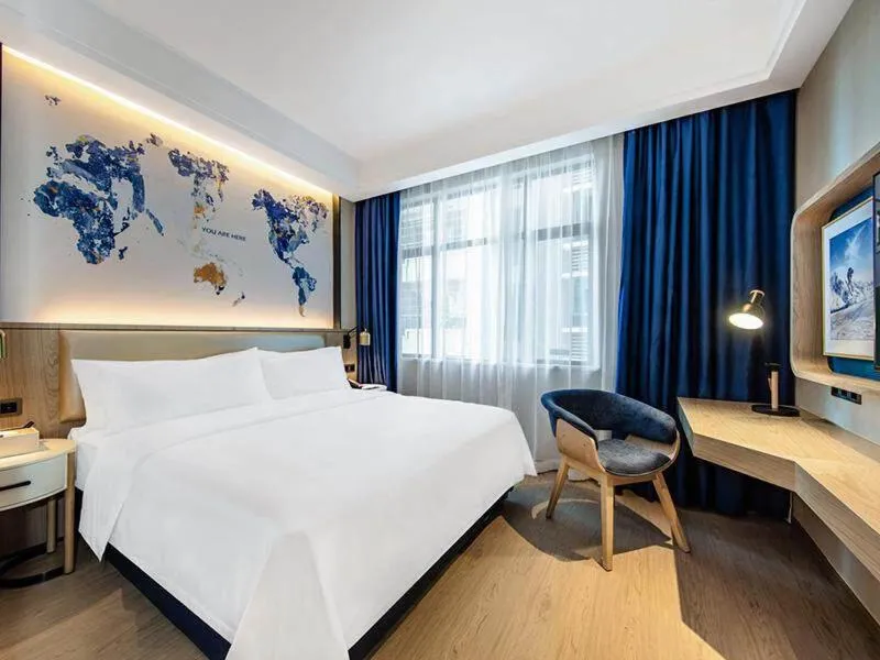 Bed in Kyriad Marvelous Hotel Haifeng