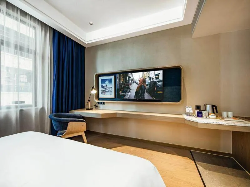 Bed in Kyriad Marvelous Hotel Haifeng