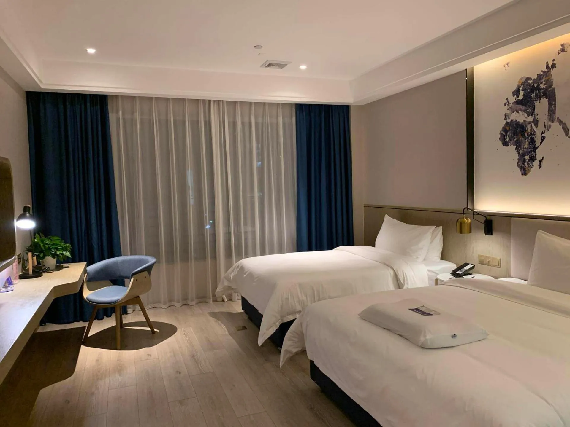 Bed in Kyriad Marvelous Hotel Heyuan Hakka Culture Park