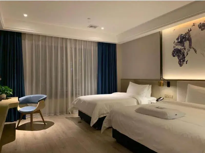 Bed in Kyriad Marvelous Hotel Heyuan Hakka Culture Park Bed in Kyriad Marvelous Hotel Heyuan Hakka Culture Park