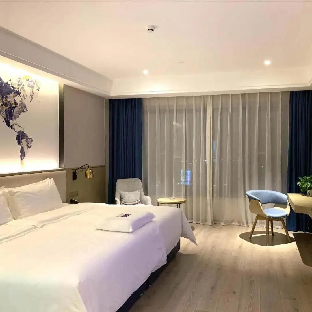 Bed in Kyriad Marvelous Hotel Heyuan Hakka Culture Park Bed in Kyriad Marvelous Hotel Heyuan Hakka Culture Park