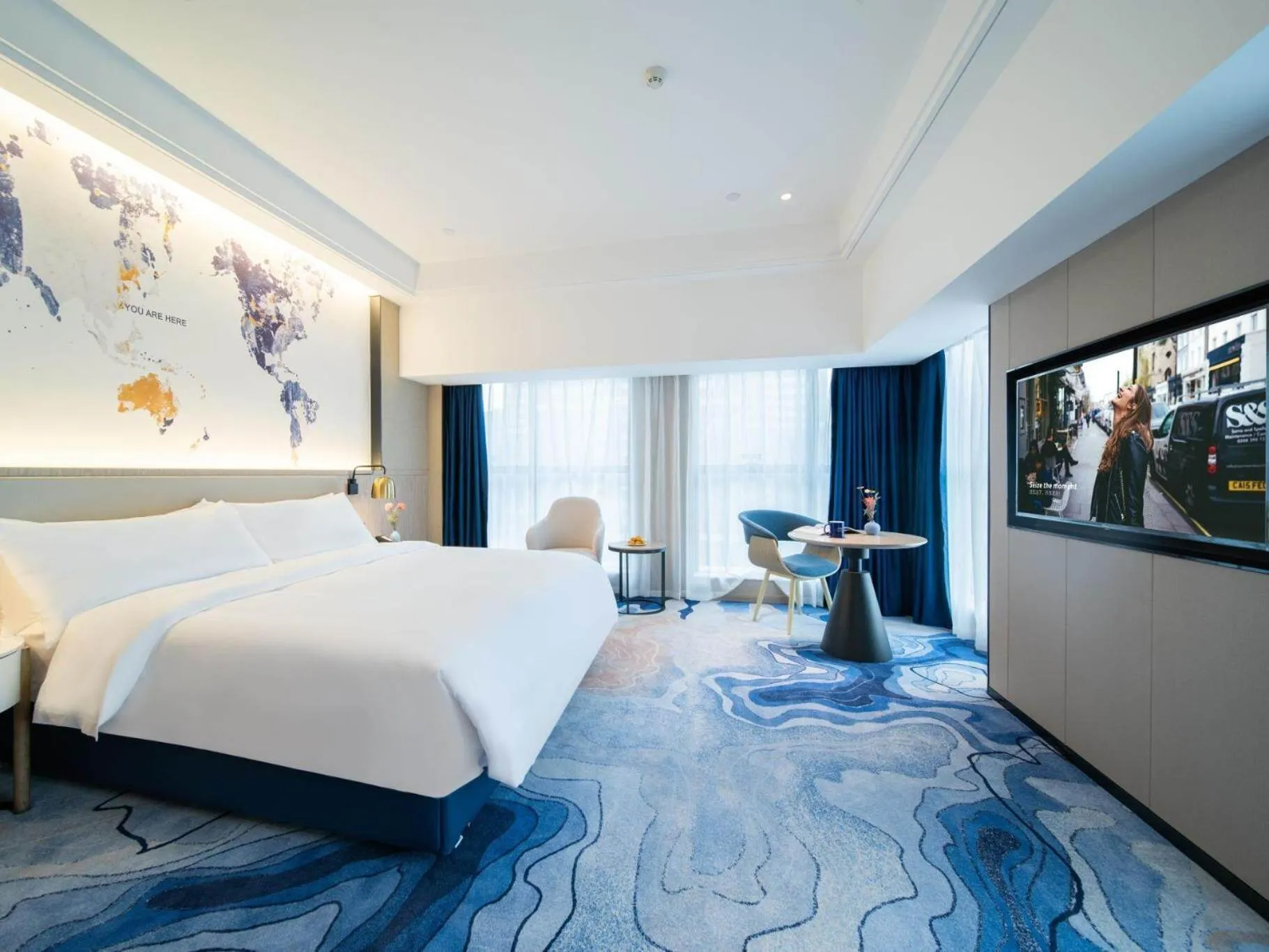 Bed in Kyriad Marvelous Hotel Heyuan Zijin Wanhui Plaza