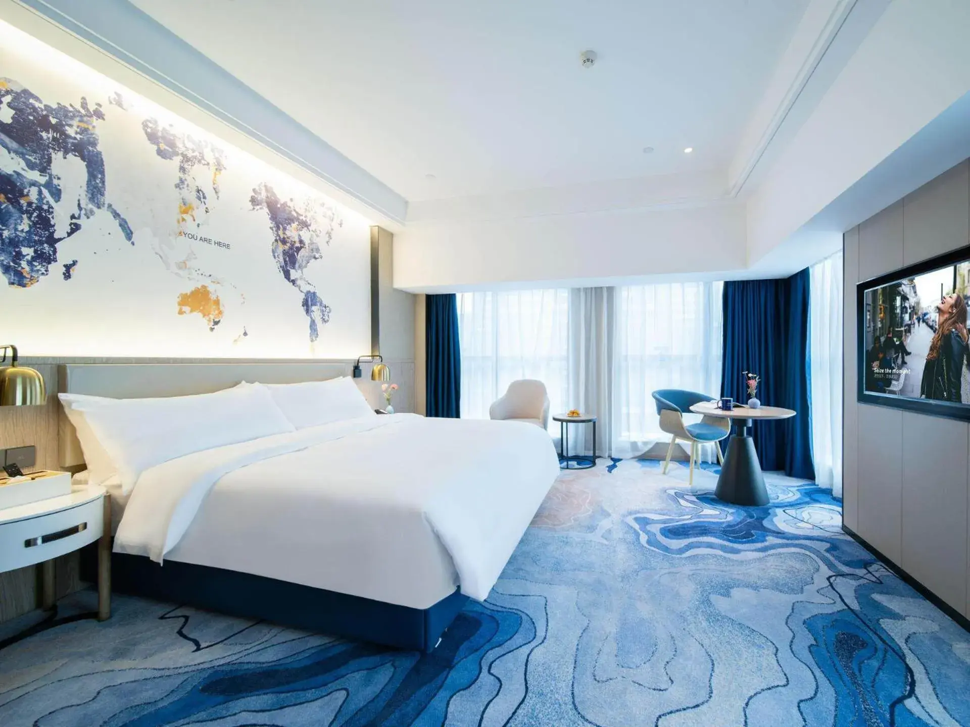 Bed in Kyriad Marvelous Hotel Heyuan Zijin Wanhui Plaza Bed in Kyriad Marvelous Hotel Heyuan Zijin Wanhui Plaza