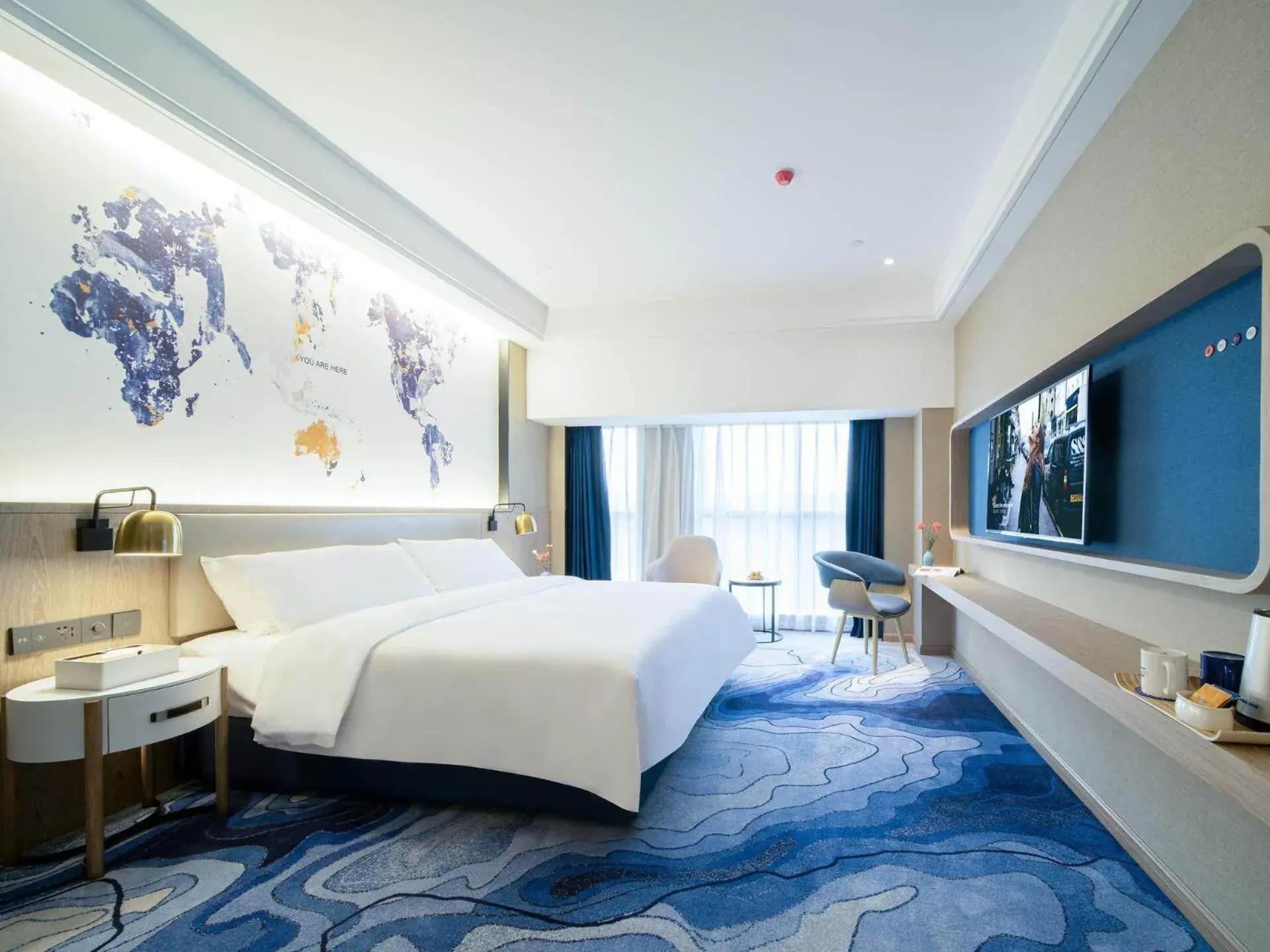 Bed in Kyriad Marvelous Hotel Heyuan Zijin Wanhui Plaza Bed in Kyriad Marvelous Hotel Heyuan Zijin Wanhui Plaza