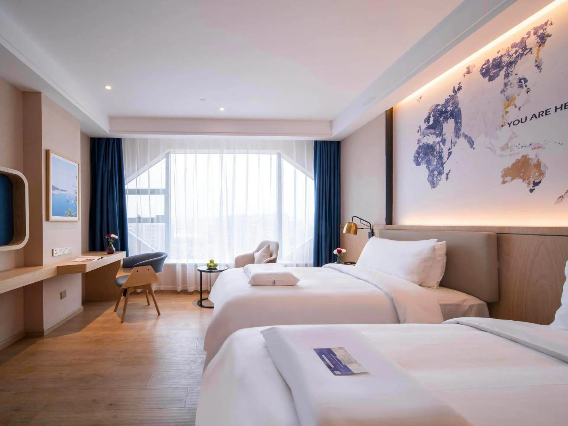 Bed in Kyriad Marvelous Hotel Heyuan Wanda Plaza