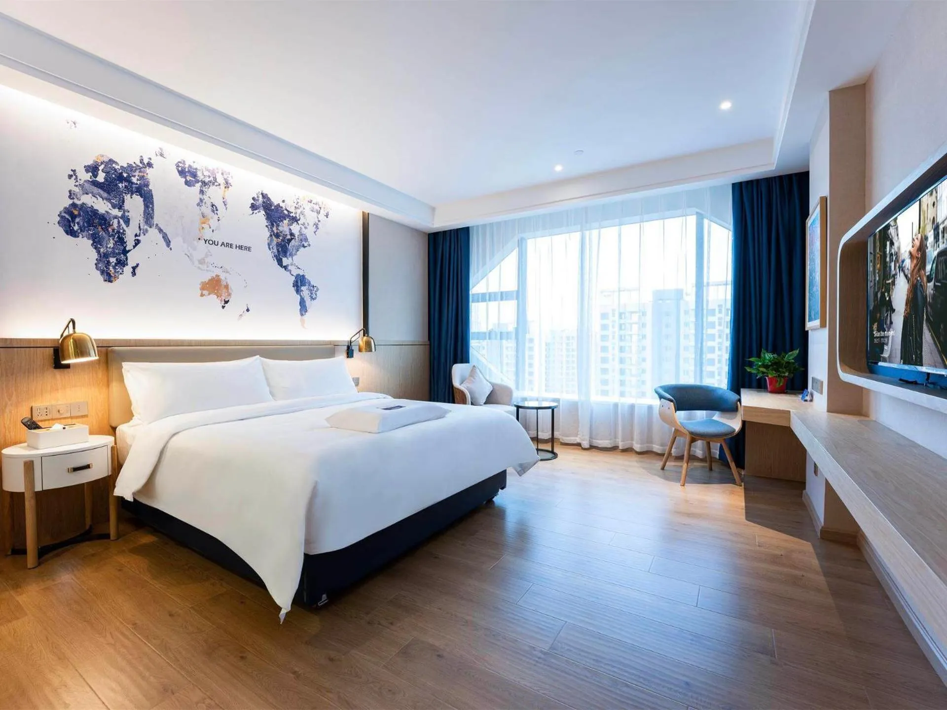 Bed in Kyriad Marvelous Hotel Heyuan Wanda Plaza