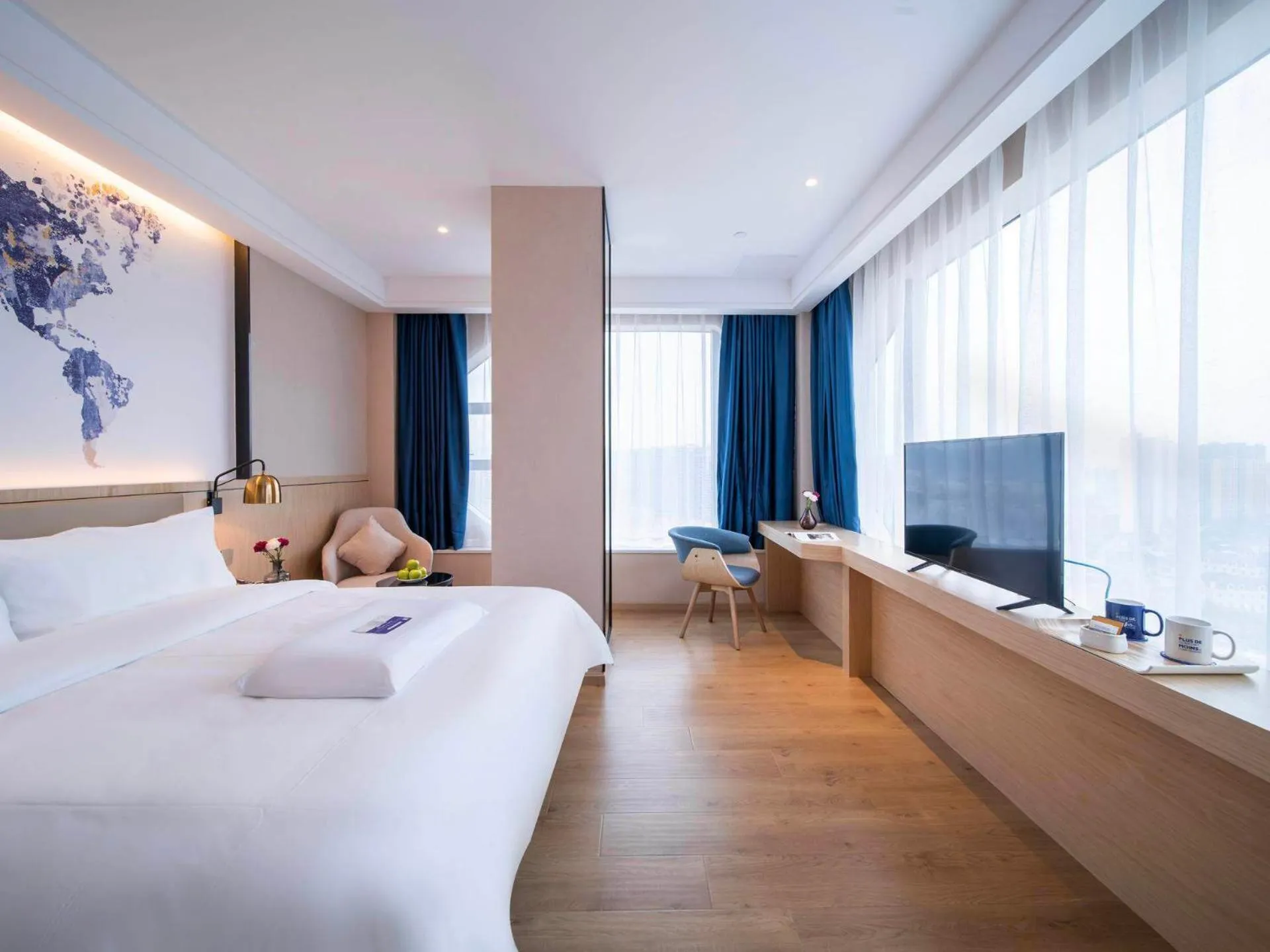 Bed in Kyriad Marvelous Hotel Heyuan Wanda Plaza