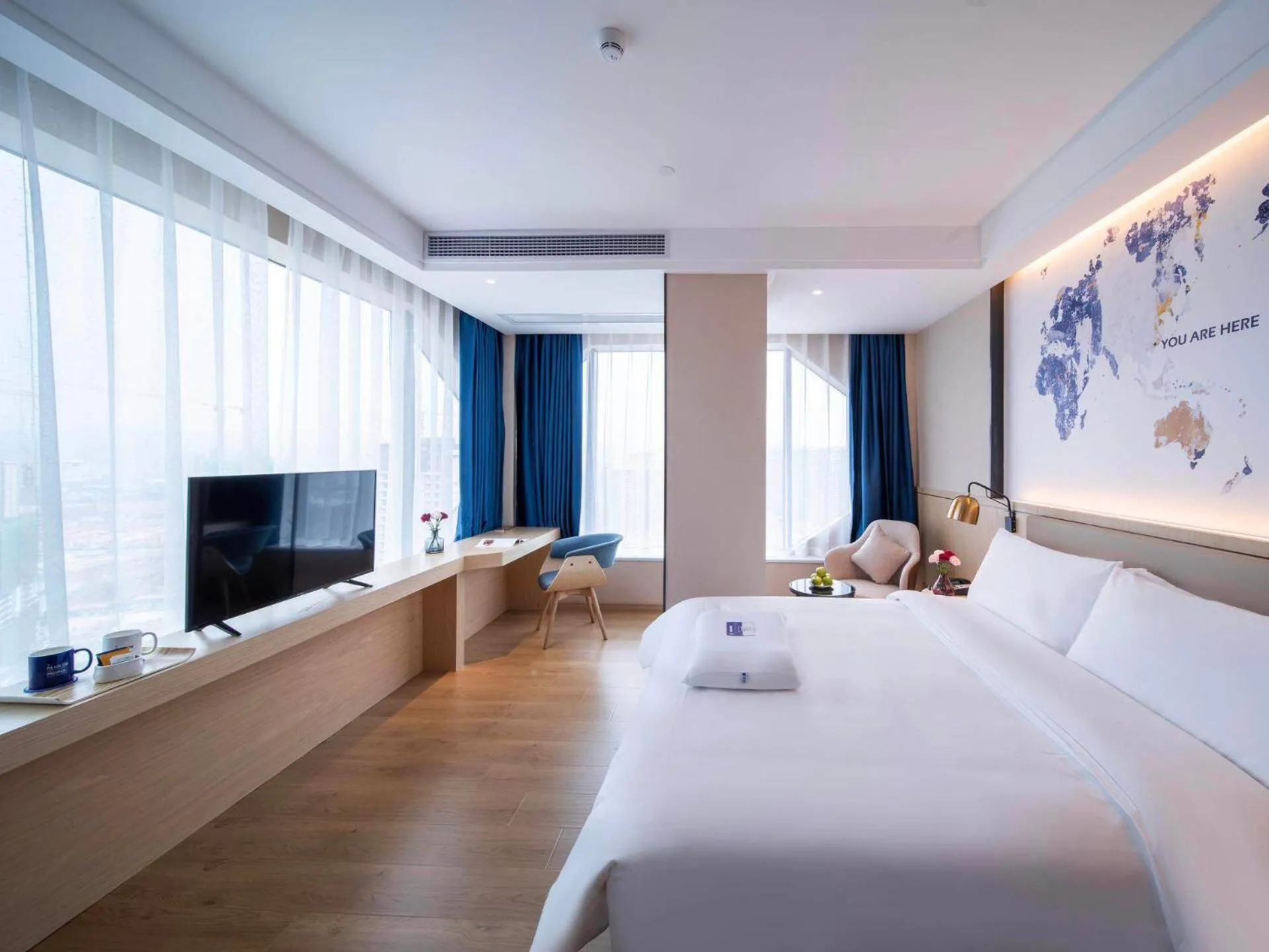 Bed in Kyriad Marvelous Hotel Heyuan Wanda Plaza