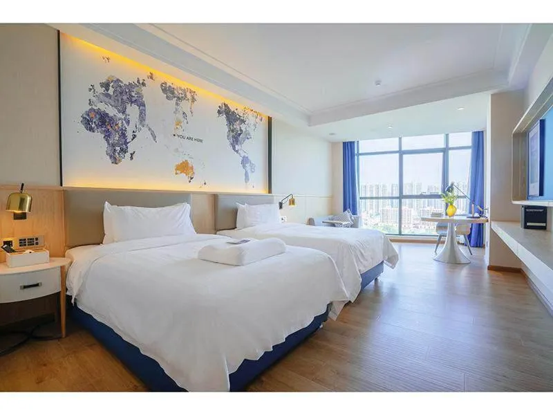 Bed in Kyriad Marvelous Hotel Heyuan Wanlong City