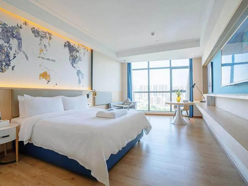 Bed in Kyriad Marvelous Hotel Heyuan Wanlong City
