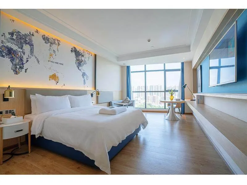Bed in Kyriad Marvelous Hotel Heyuan Wanlong City
