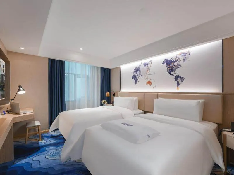 Bed in Kyriad Marvelous Hotel Shenzhen Guangming Zhenmei Subway Station