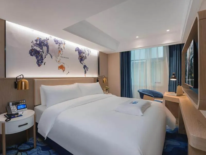 Bed in Kyriad Marvelous Hotel Shenzhen Guangming Zhenmei Subway Station
