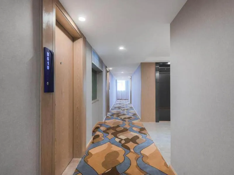 Bed in Kyriad Marvelous Hotel Shenzhen Guangming Zhenmei Subway Station