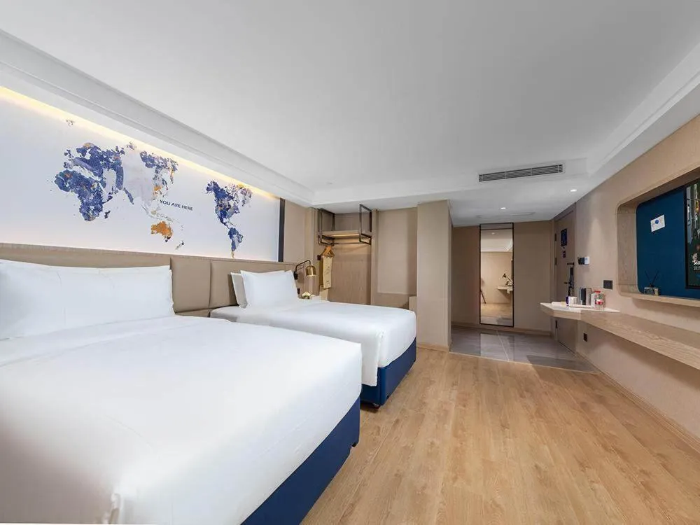 Bed in Kyriad Marvelous Hotel Shenzhen Nanlian Metro Station