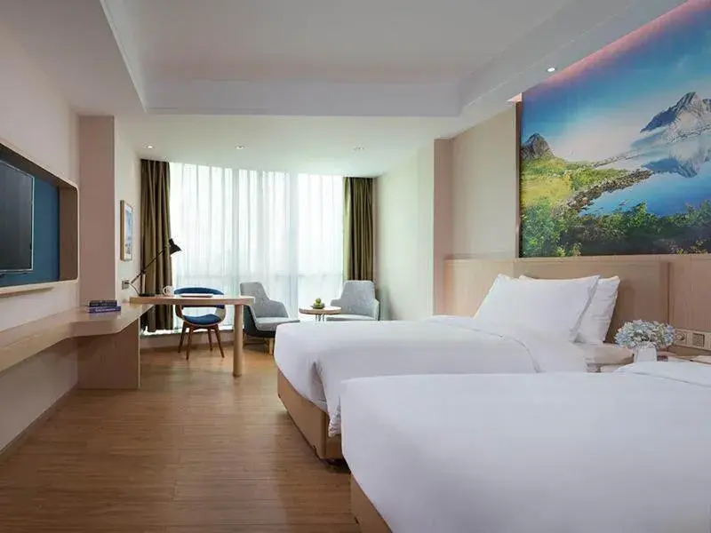 Bed in Kyriad Marvelous Hotel Dongguan Huangjiang Jingyi Bed in Kyriad Marvelous Hotel Dongguan Huangjiang Jingyi