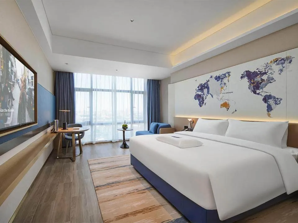 Bed in Kyriad Hotel Dongguan Houjie Convention and Exhibition Center Humen Station