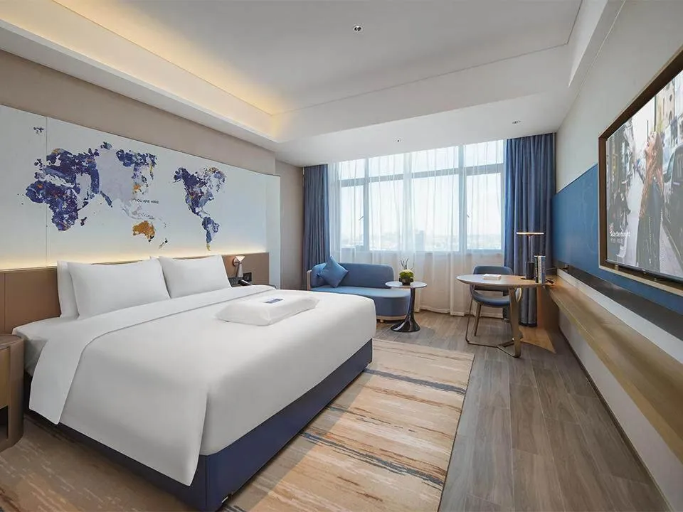 Bed in Kyriad Hotel Dongguan Houjie Convention and Exhibition Center Humen Station