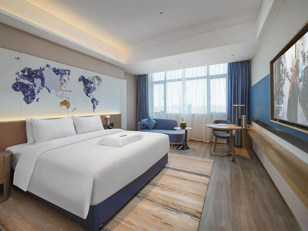 Bed in Kyriad Hotel Dongguan Houjie Convention and Exhibition Center Humen Station