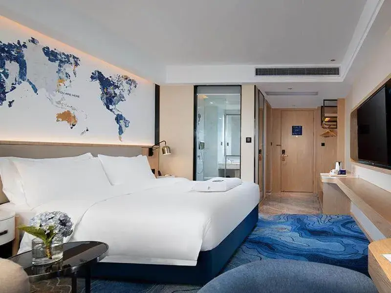Bed in Kyriad Marvelous Hotel Maoming Dianbai Wanda Plaza Bed in Kyriad Marvelous Hotel Maoming Dianbai Wanda Plaza