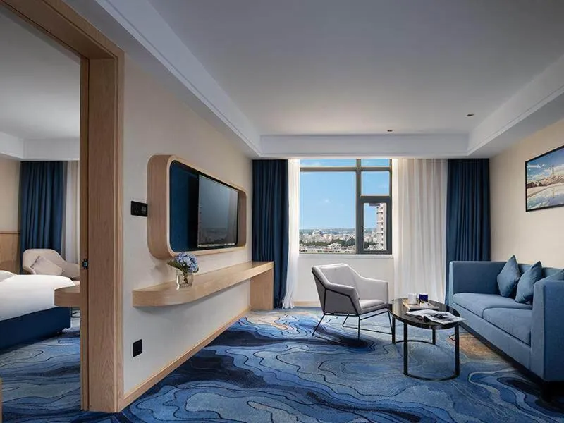 Bed in Kyriad Marvelous Hotel Maoming Dianbai Wanda Plaza