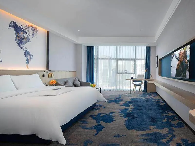 Bed in Kyriad Marvelous Hotel Fangchenggang Administration Center High-Speed Railway Station