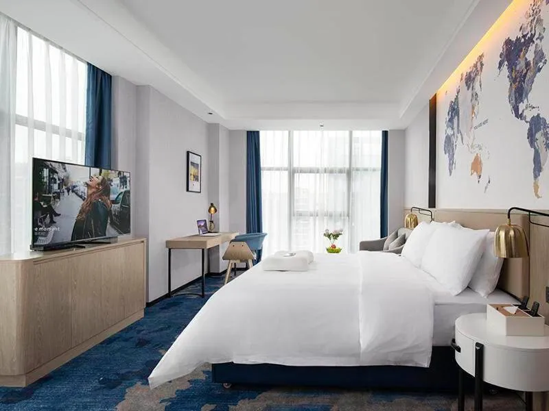 Bed in Kyriad Marvelous Hotel Fangchenggang Administration Center High-Speed Railway Station